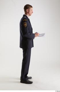 Sam Atkins Fireman in Uniform standing whole body writing notes…